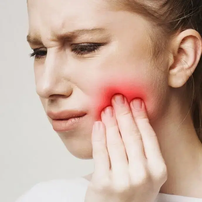 woman with a toothache needing root canal treatment